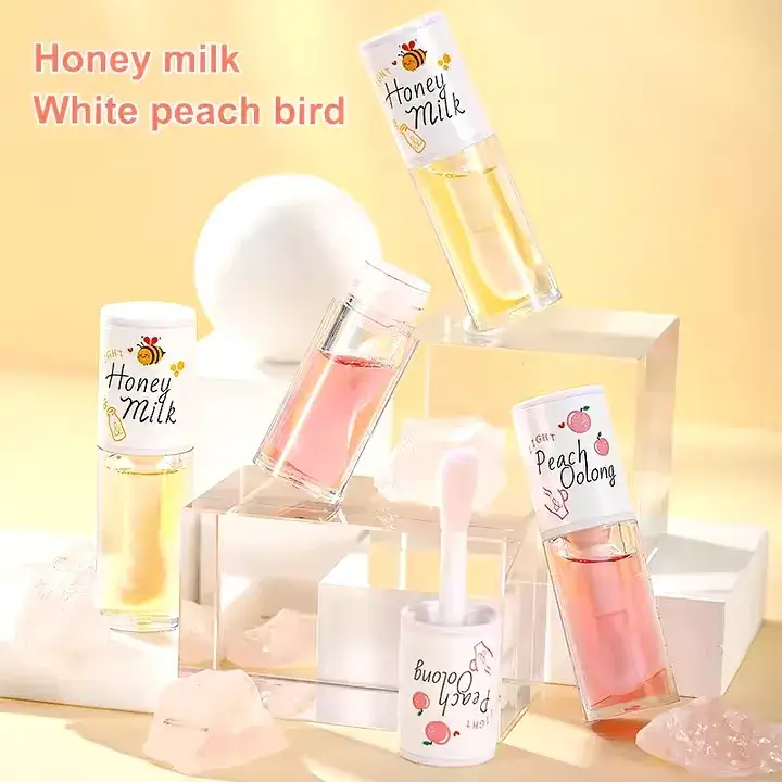 Bear Crystal Jelly Lip Oil Honey Milk and Peach Oolong bottles