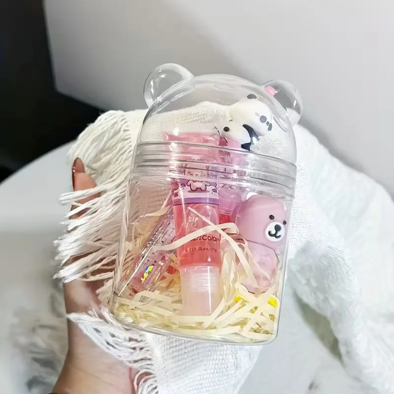 Close-up of the transparent bear jar packaging for the pink lip makeup set.
