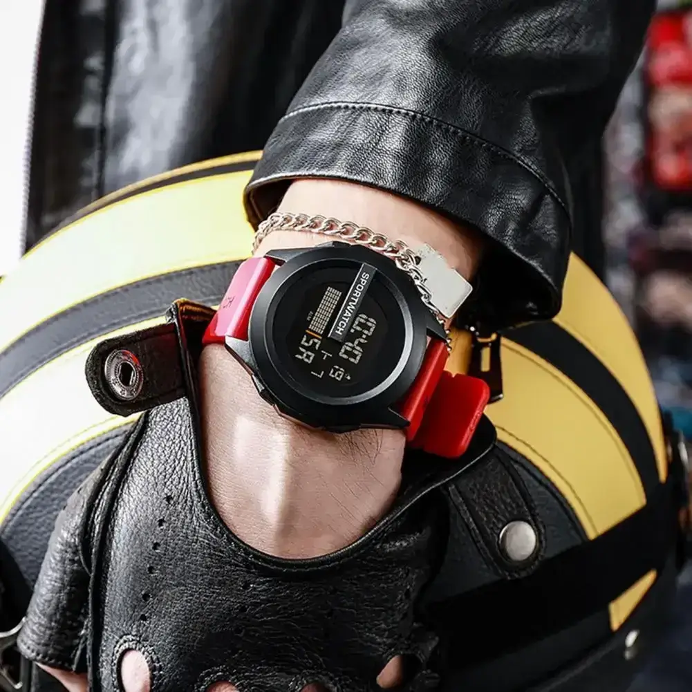 Men's tactical digital watch with red strap on wrist with motorcycle helmet