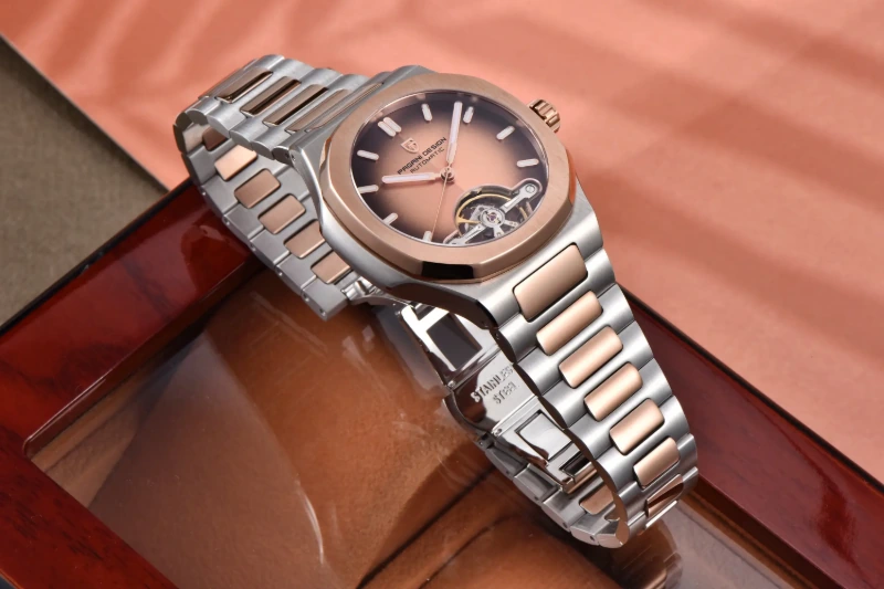 Side view of Pagani Design mechanical watch showcasing the rose gold and silver stainless steel integrated bracelet.