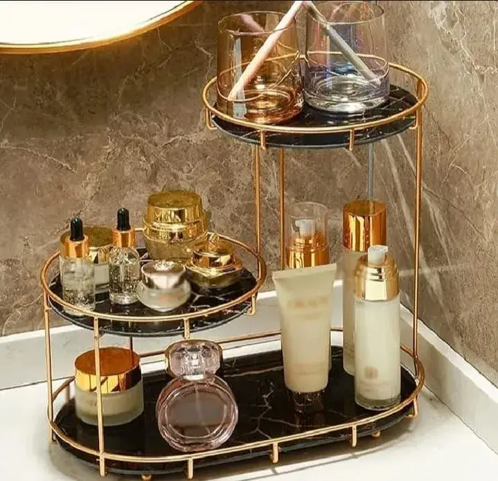 Creative vanity table organization ideas using a gold perfume holder