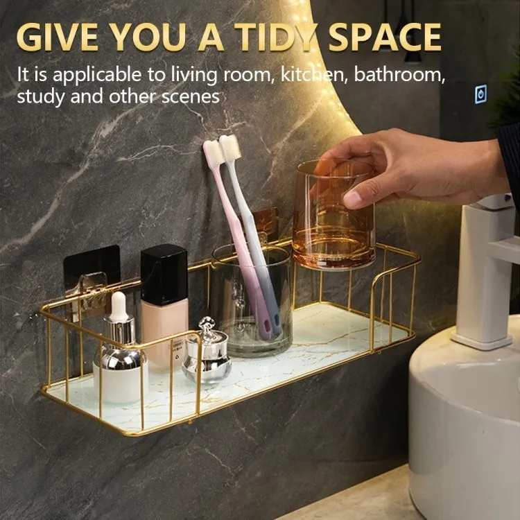 Person placing a glass on the bathroom wall shelf.