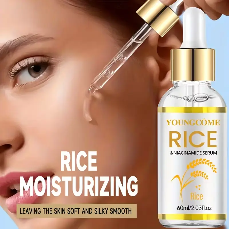 Dropper applying clear Youngcome Rice and Niacinamide serum for silky smooth skin texture.