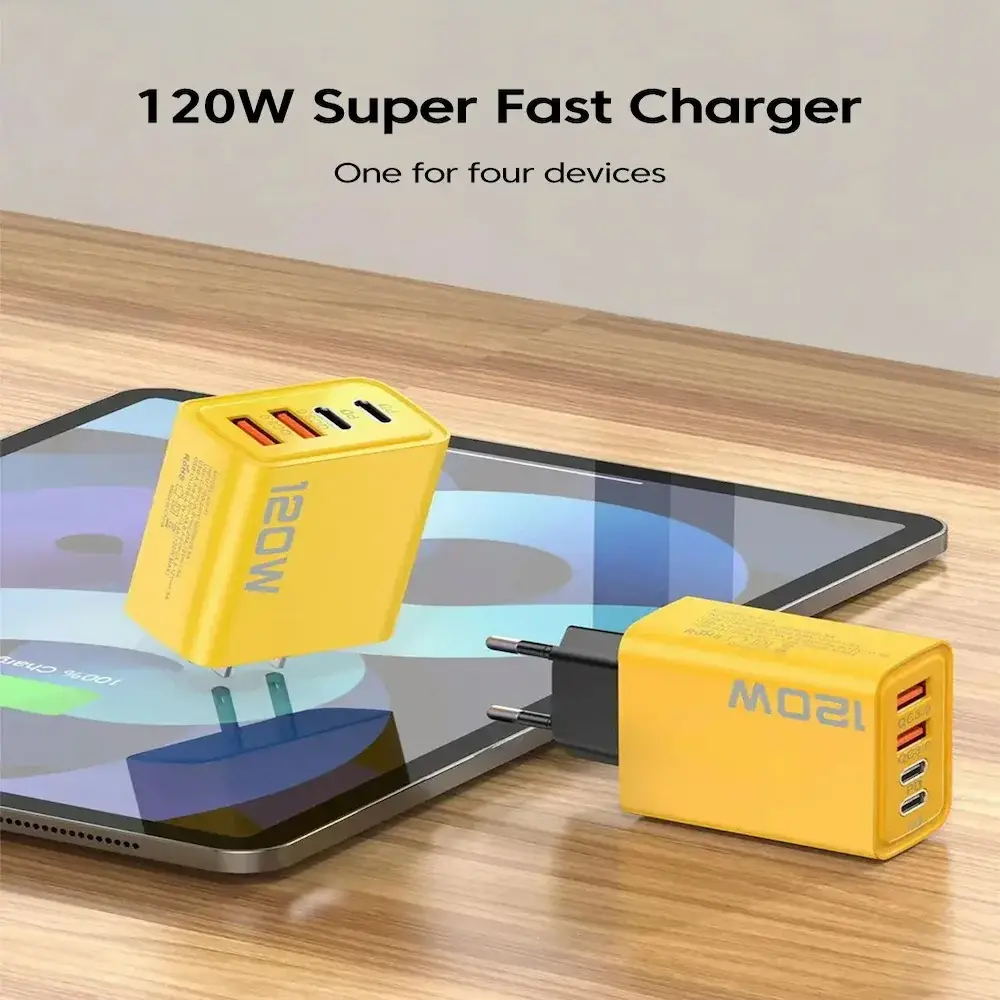 Yellow multi-port charging block powering up multiple devices simultaneously on a table.