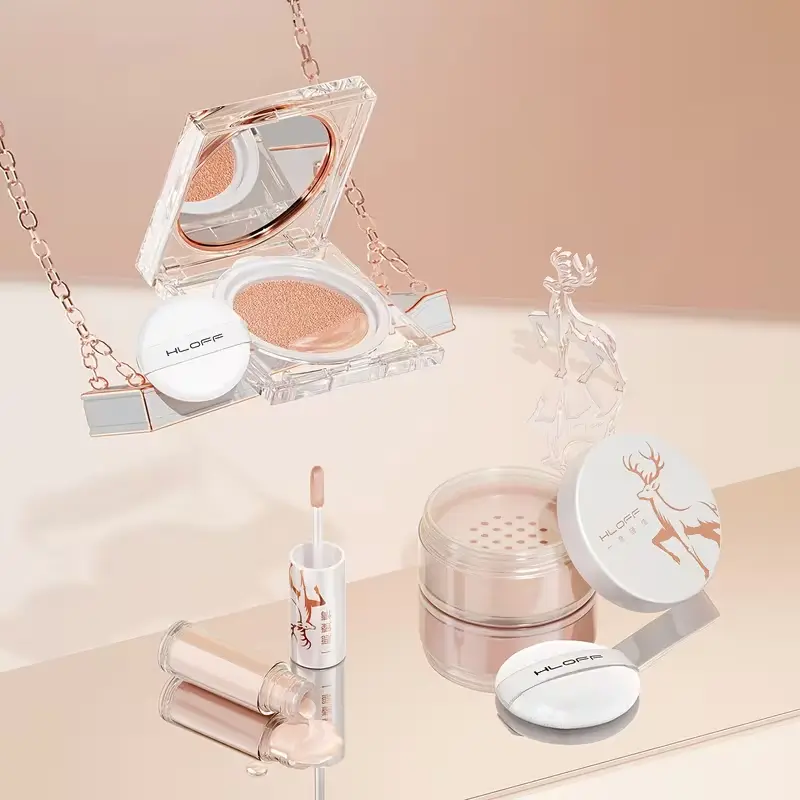 Luxury cushion compact, loose setting powder, and concealer with white puff applicators.