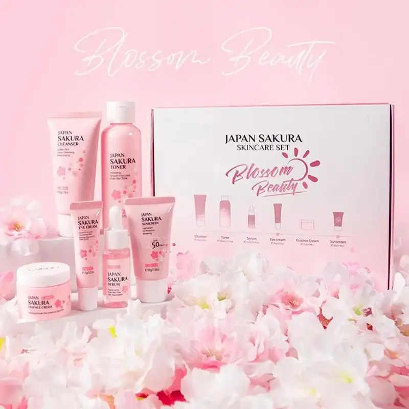 Complete LAIKOU Blossom Beauty Japan Sakura Skincare Set with gift box on a bed of pink flowers.