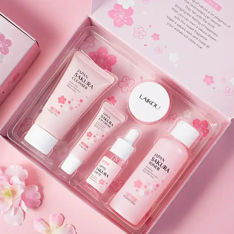 LAIKOU cherry blossom pink skincare products neatly arranged inside an opened gift box wrapper.