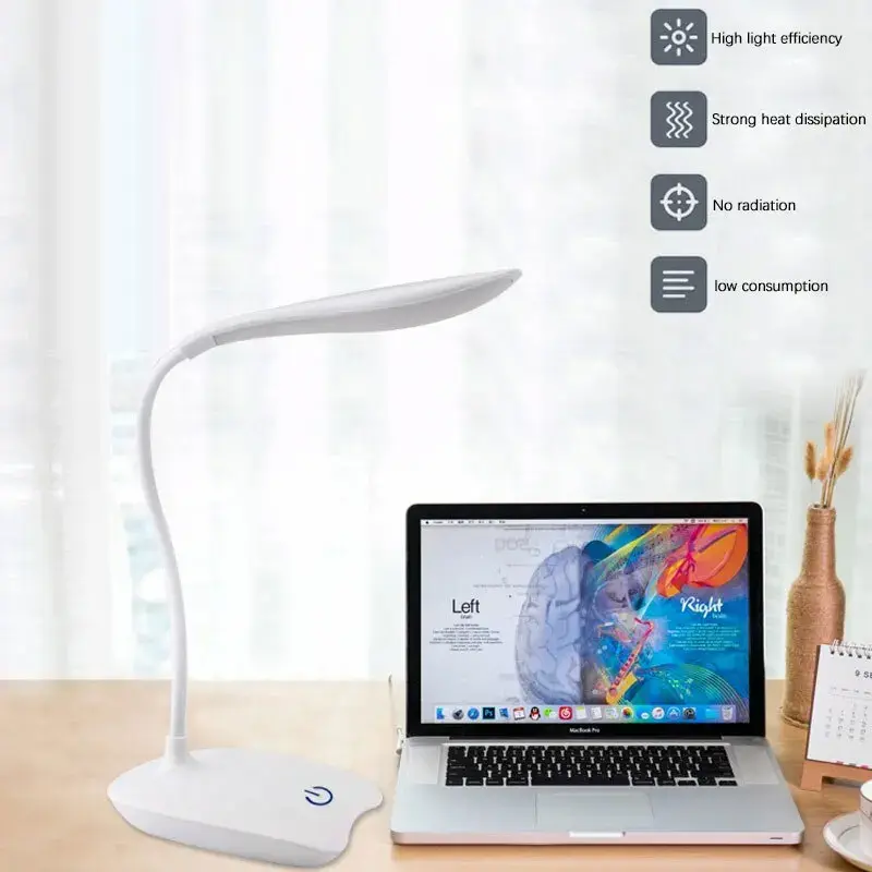 Modern study desk setup with a laptop and a white rechargeable LED eye protection lamp.