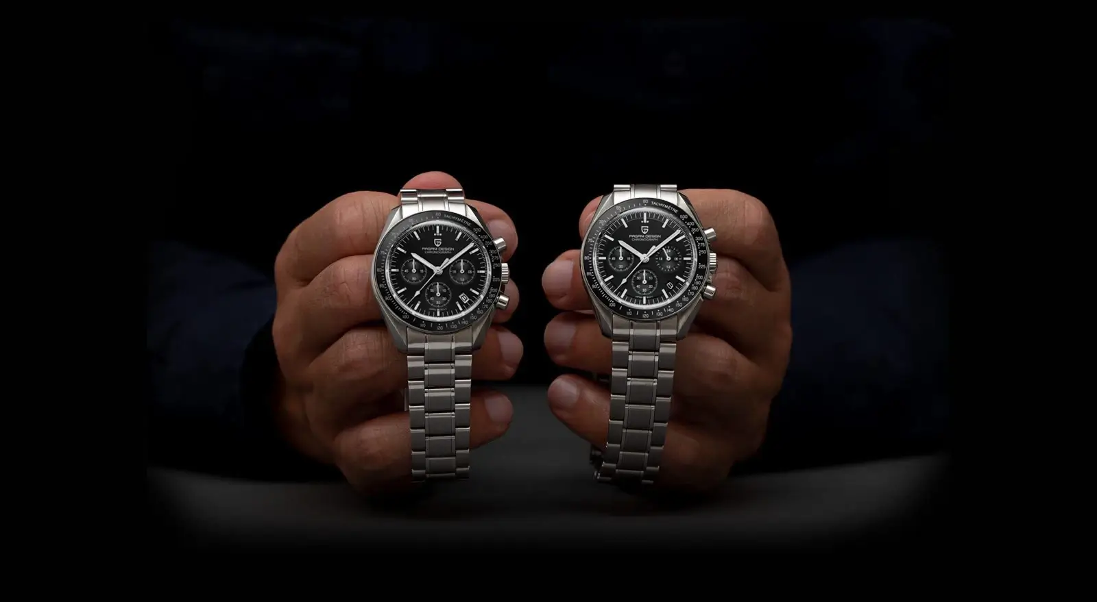 Comparison of two Pagani Design PD-1701 black dial chronograph watches held in hands for size reference.