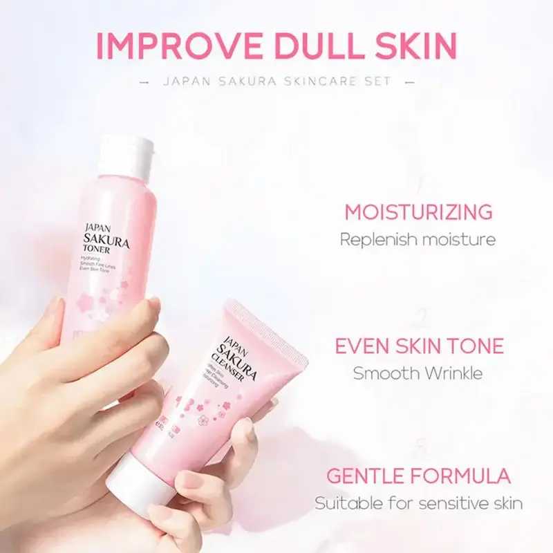 A person holding the pink toner and cleanser bottles from the Japanese cherry blossom collection.