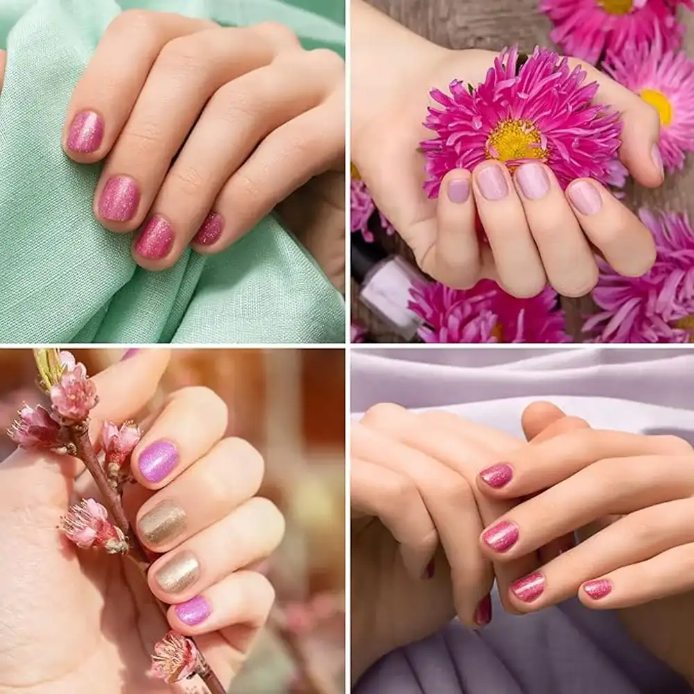 Close-up of elegant pink and gold shimmer manicured hands holding bright pink flowers.
