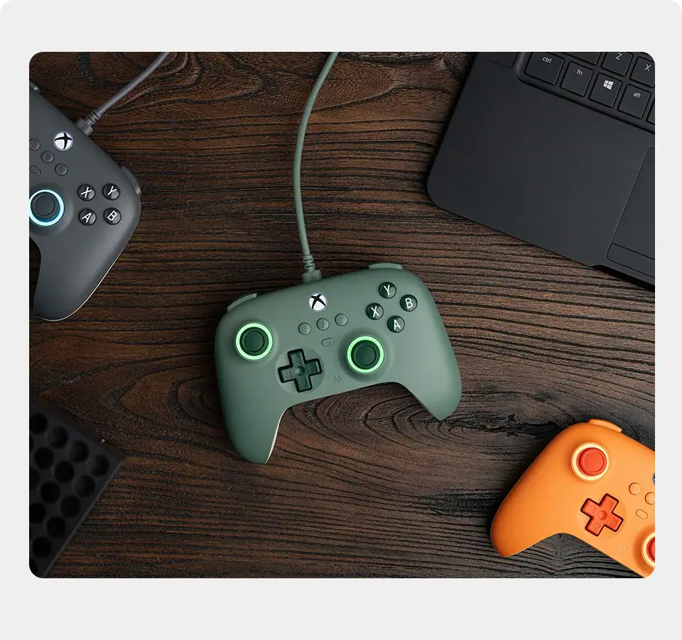 Close-up shot of the 8BitDo controller being held, showing the official Xbox button and the fine matte texture of the shell.