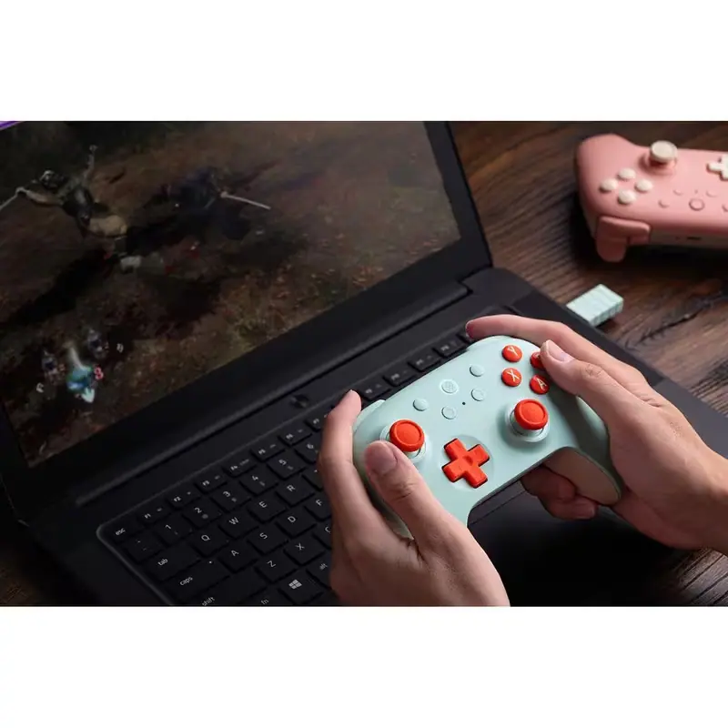 8BitDo Ultimate 2C controller used on a gaming laptop
