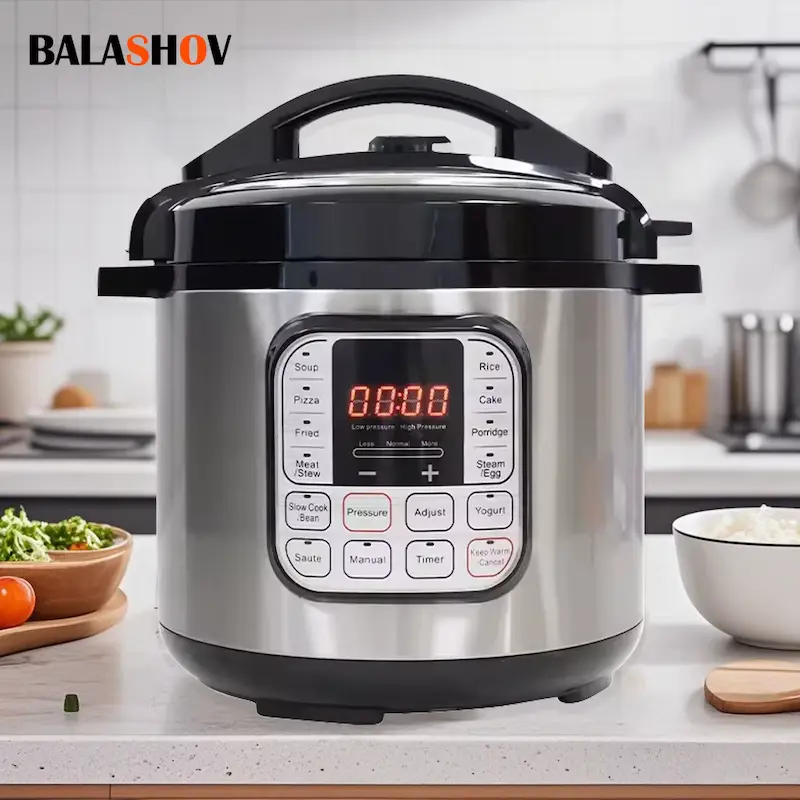 An elegant stainless steel smart multicooker on a clean kitchen countertop next to fresh vegetables.