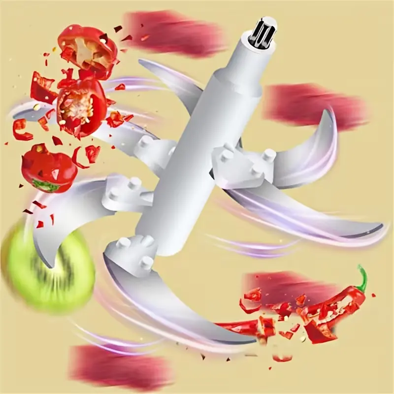 Close-up of bi-level stainless steel blades chopping fruits and vegetables mid-air.