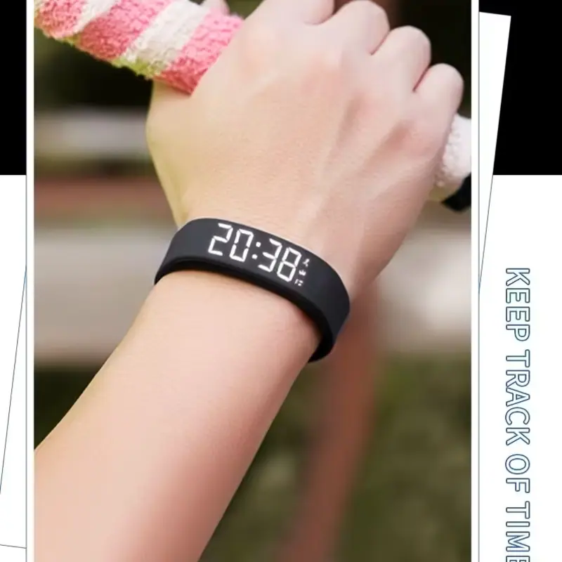 Close-up of a black minimalist wristwatch on a hand holding a sports handle