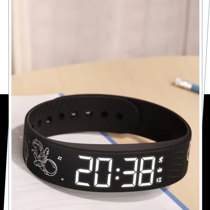 Black digital watch with astronaut graphics on the strap