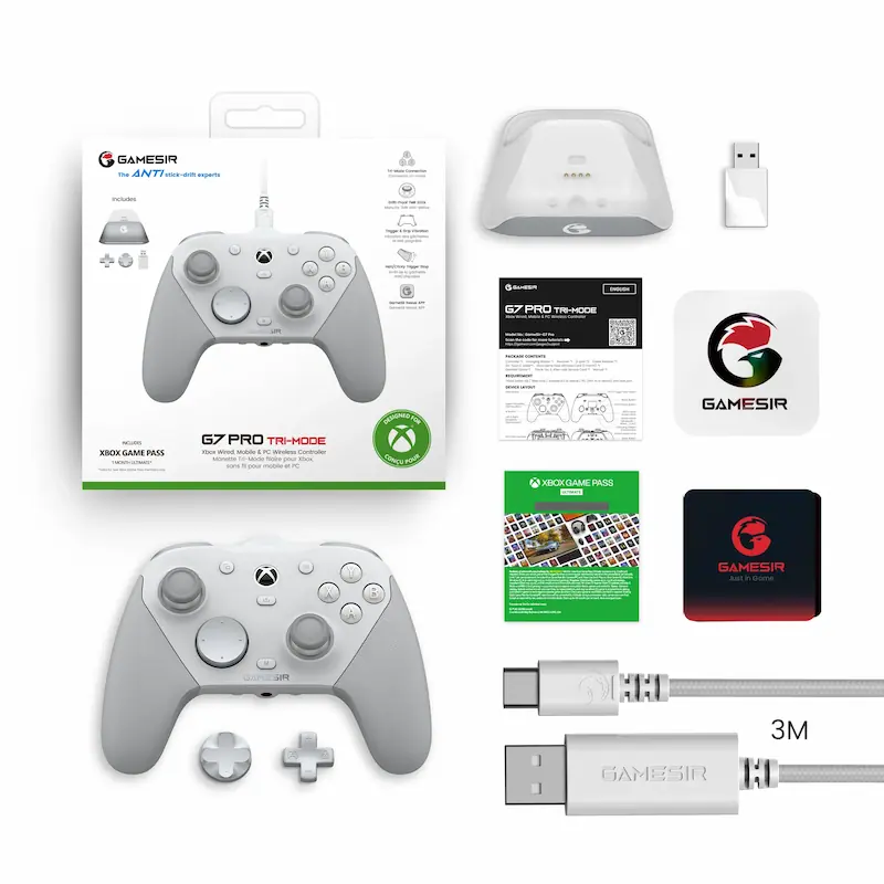 Overhead shot of a white game pad layout with all its box contents, cables, and accessories.