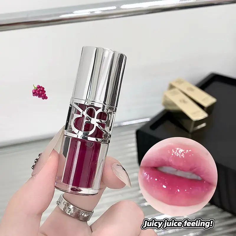 A deep berry shade of Gege Bear lip gloss next to a juicy lip swatch illustration.