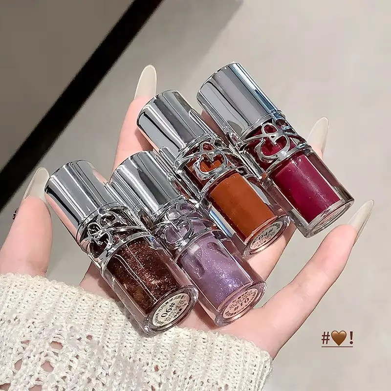 Four different shades of Gege Bear moisturizing lipsticks held in hand to find the Best Budget Water Gloss color.