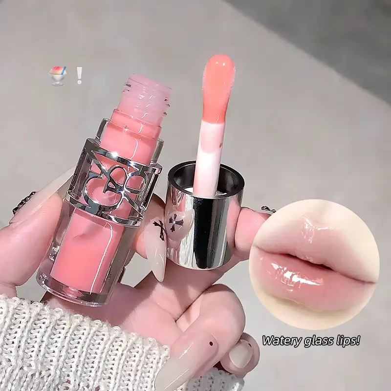 Gege Bear pink lip gloss opened with its applicator showing a soft pink watery glass lips swatch.