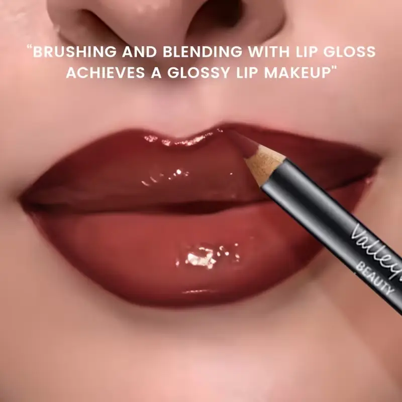 Blending lip gloss with liner for a glossy makeup finish.