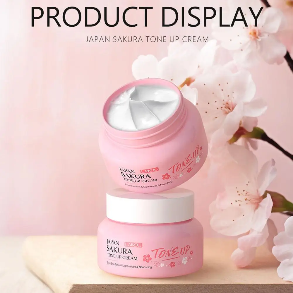 LAIKOU Japan Sakura Tone Up Cream jar with cherry blossom petals for skin brightening.