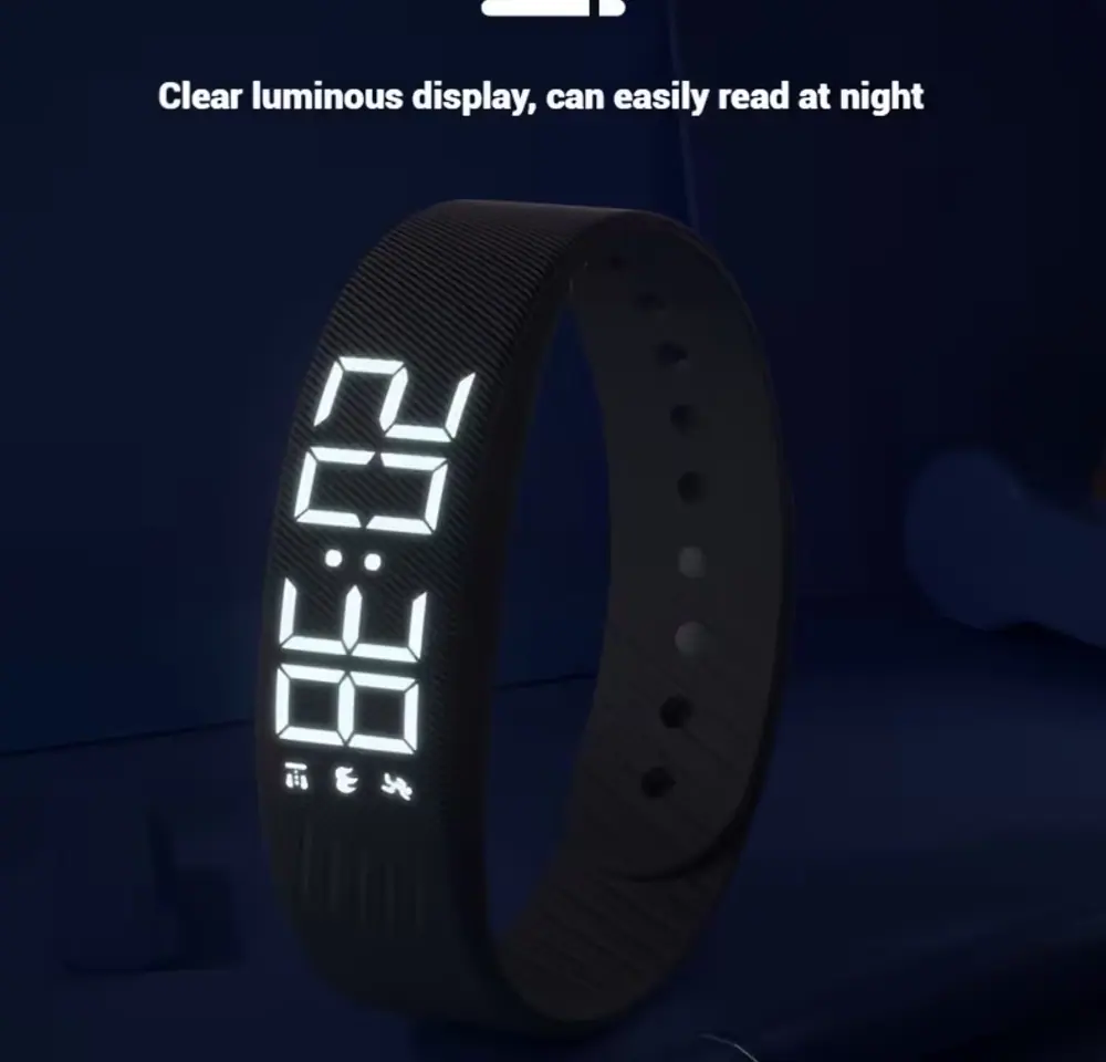 Digital watch with bright white LED numbers glowing in the dark