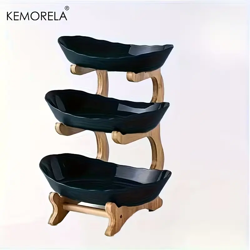 Minimalist studio shot of the Green KEMORELA 3-tier fruit basket on a white background.