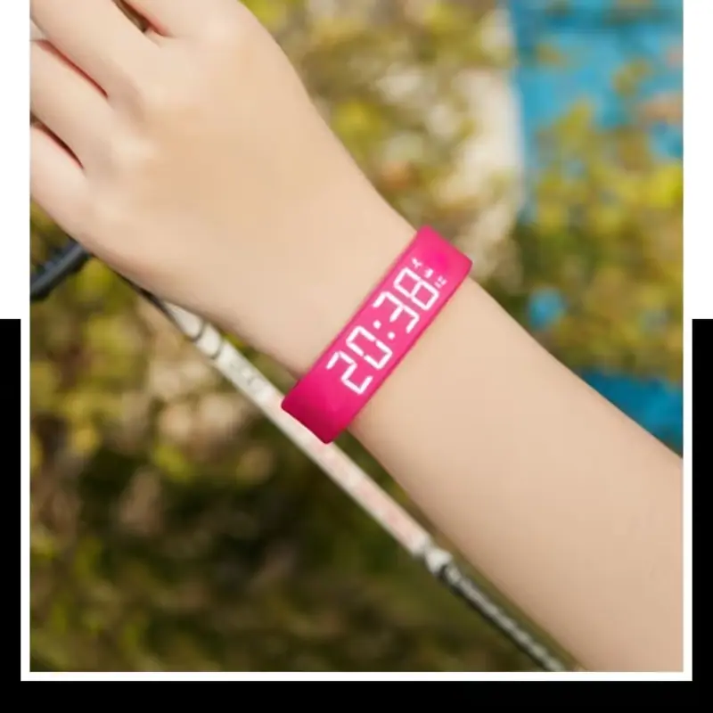 Vibrant pink digital wristwatch worn on a wrist, featuring a clear luminous time display