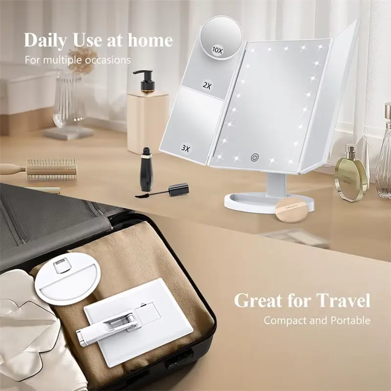 White portable LED folding makeup mirror shown both set up on a counter and collapsed flat inside luggage.