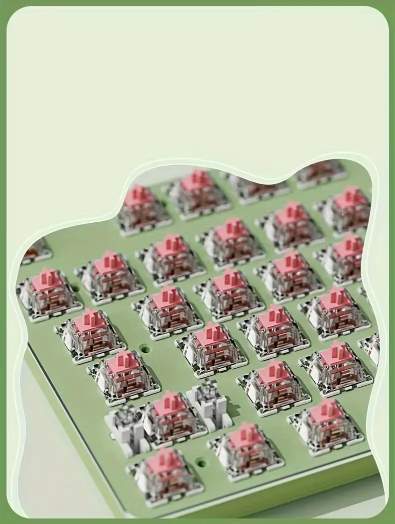 Exposed mechanical pink switches under the keycaps of the EWEADN keyboard.