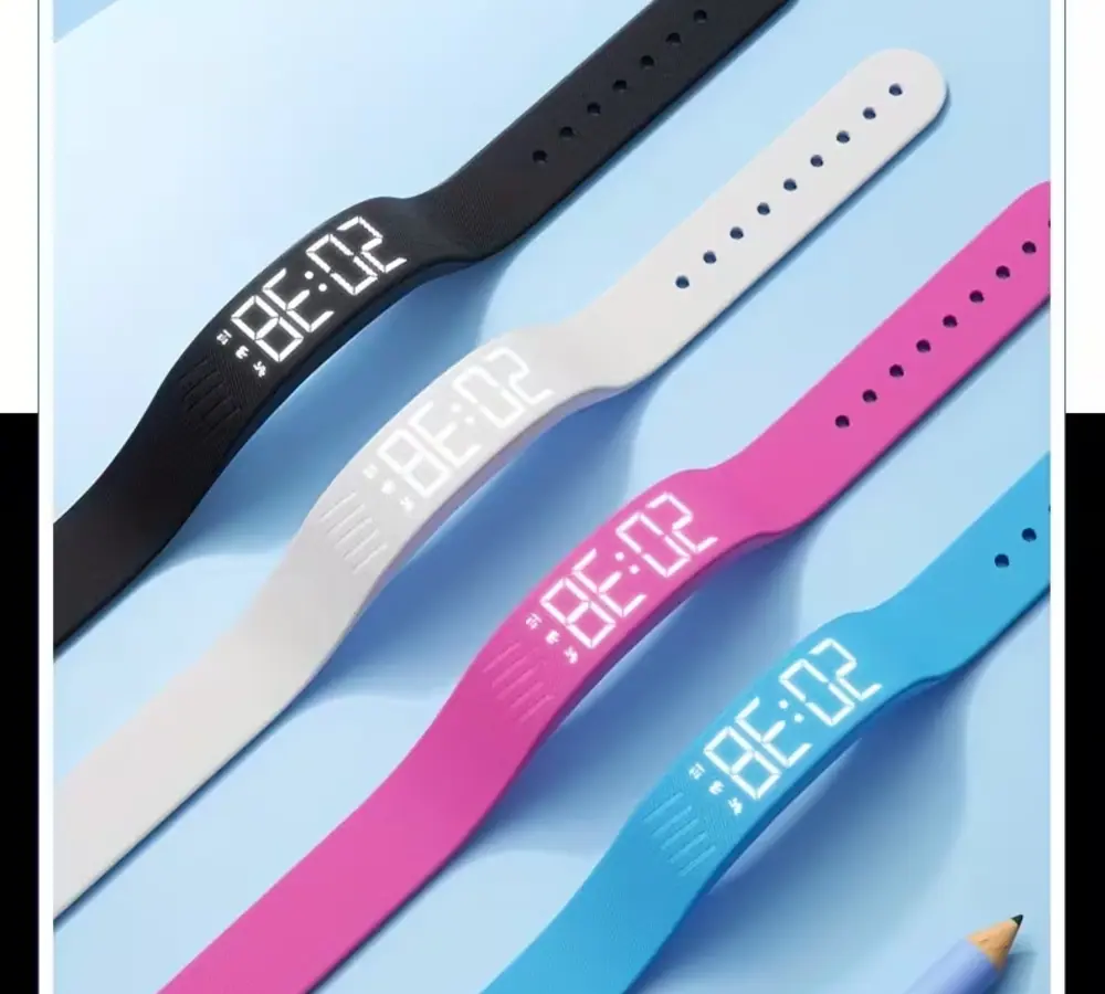 Four minimalist digital watches in black, white, pink, and blue colors