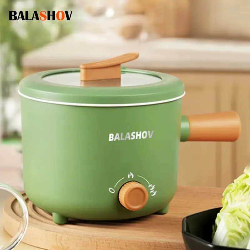 Green compact BALASHOV Electric Pot Review unit placed on a wooden countertop.