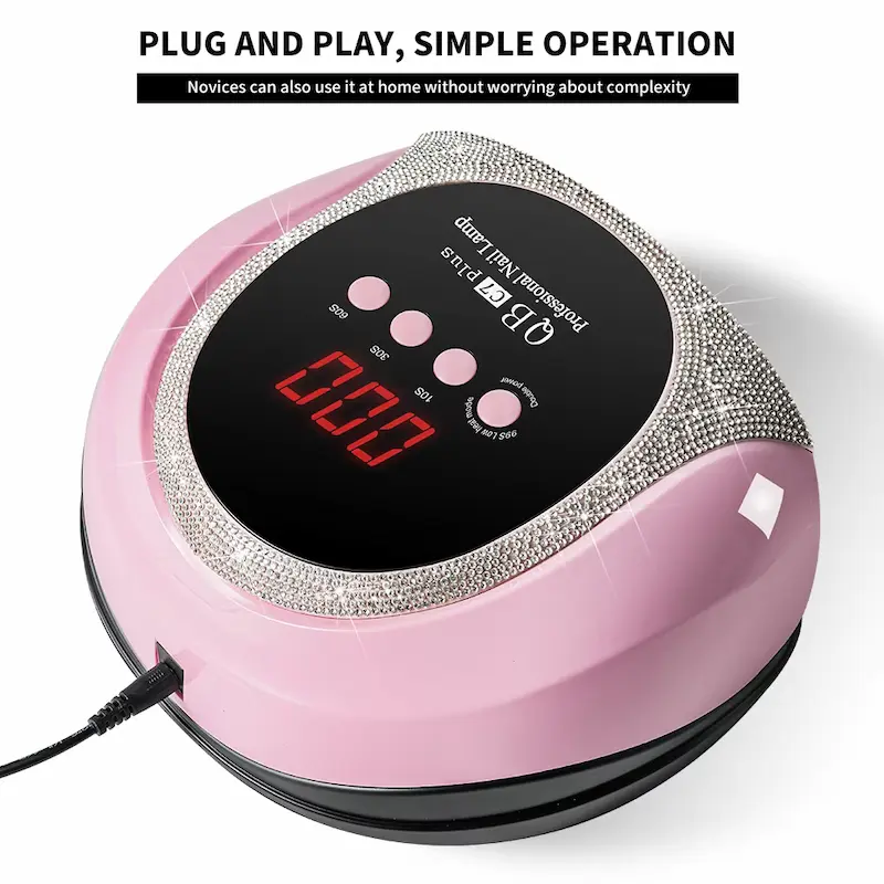 Close-up of the elegant pink nail lamp with crystal embellishments and plug-and-play setup.