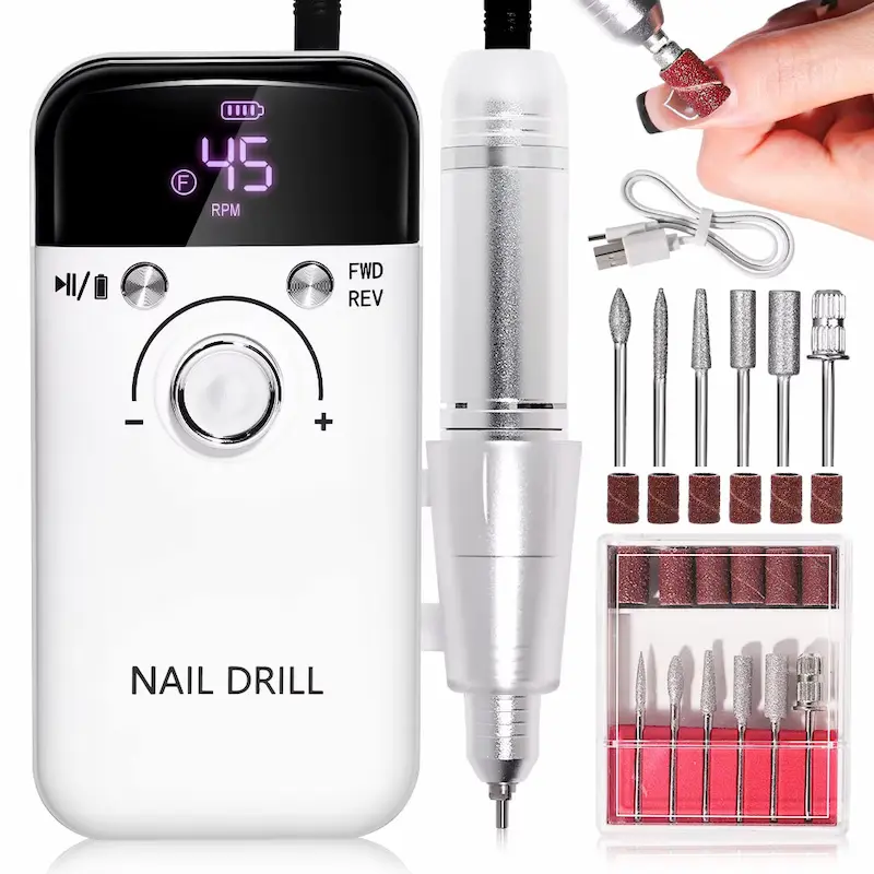 A complete professional nail drill kit featuring a white rechargeable control box with a digital display, a silver handpiece, charging cable, and a set of metal drill bits with sanding bands.