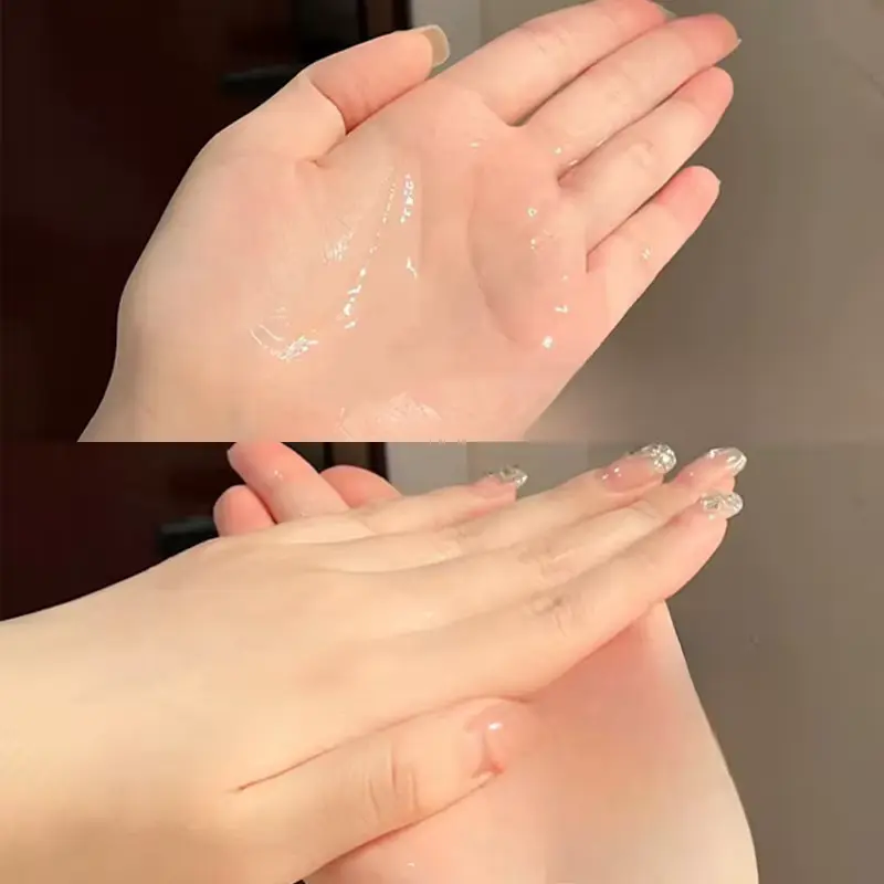Close-up of the clear, smooth texture of CCBOX hair serum being rubbed on palms.