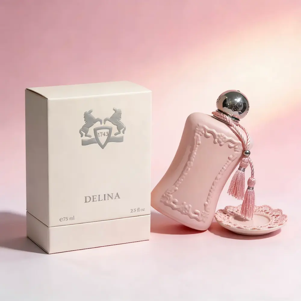 Parfums de Marly Delina 75ml Eau de Parfum standing gracefully next to its white minimalist outer packaging.