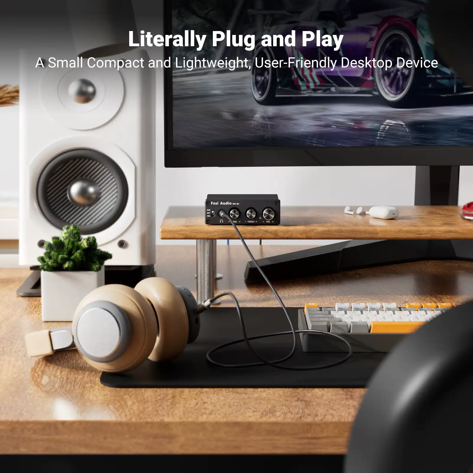 Lightweight desktop audio converter arranged neatly on a monitor riser with studio monitors and headphones.