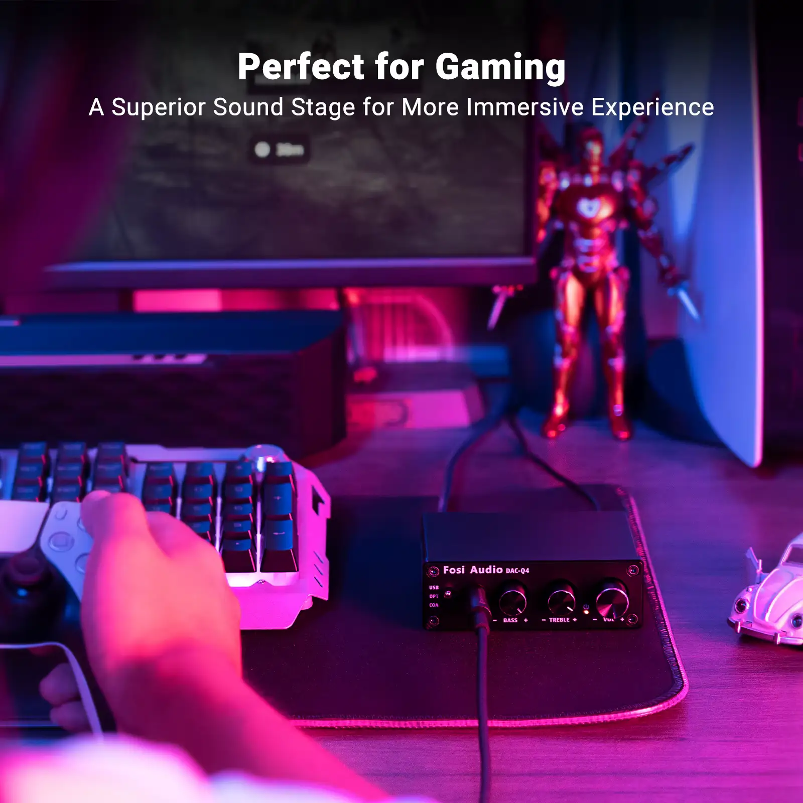 USB gaming DAC integrated into a neon-lit PC gaming setup next to a keyboard and gaming controller.