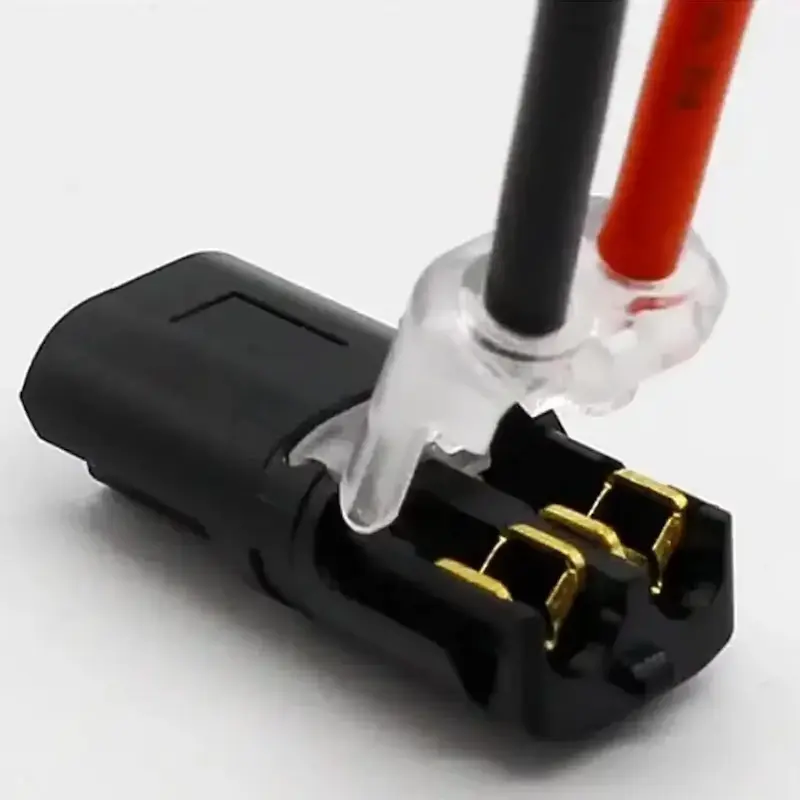 Inserting automotive wire into the 2 Pin Way Plug Waterproof Electrical Connector.
