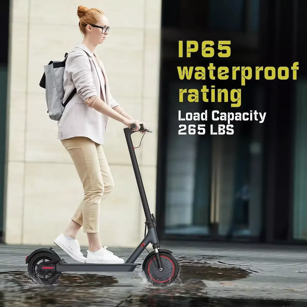 Rider riding an IP65 waterproof rated vehicle with 265 lbs load capacity.
