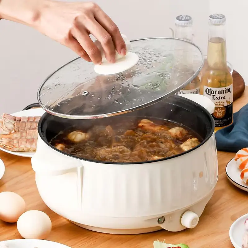 Balashov cooking pot with glass lid and food simmering inside the non-stick pan.