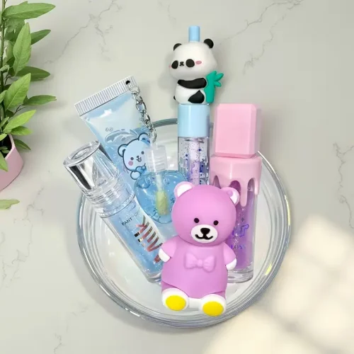 Complete 5-piece blue bear and panda-themed lip makeup set featuring glitter gloss and tinted oils.
