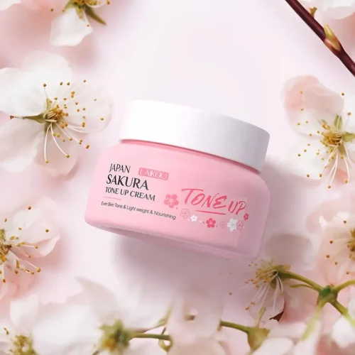 Close-up of LAIKOU Sakura Tone Up Cream pink jar on a floral background.