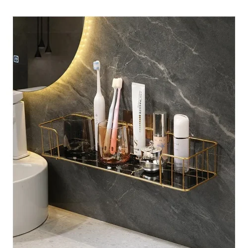 Modern shelf organized with skincare and toothbrush glasses.